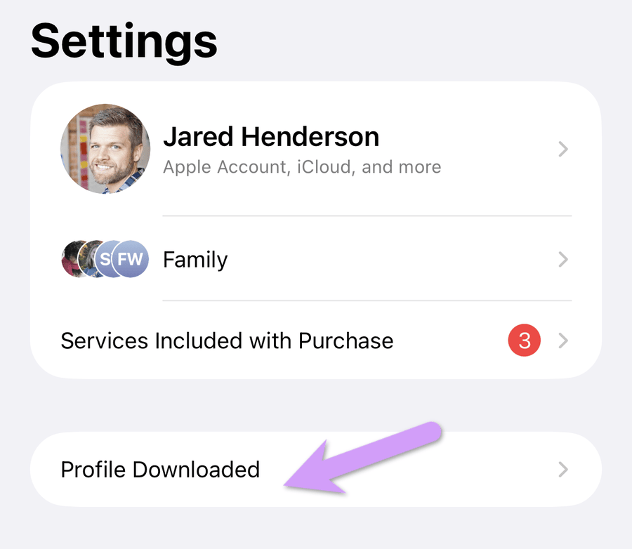 the iPhone Settings app showing a Profile Downloaded row near the top